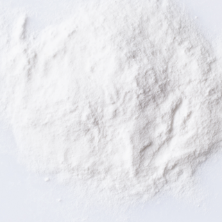 white powder that is xanthan gum clear lays on a white surface