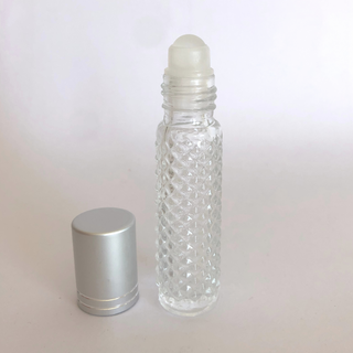 etched 10ml glass roller bottle on a white background. The lid is off