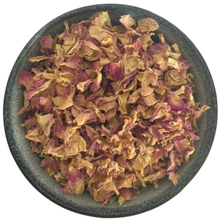 ceramic bowl filled with pretty pink rose petals