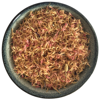  A round bowl that has dried pink cornflower petals