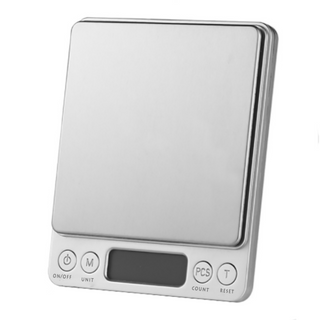0.01g scales are on a white surface, these scales are for skincare ingredients and can buy in australia