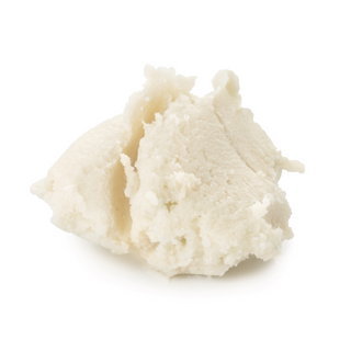 shea butter sits on a white surface