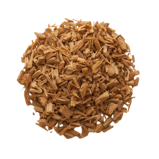 Pieces of sandalwood are arranged into a circle and are laying flat on a plain surface