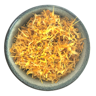 A bowl of bright yellow flowers called Calendula or Marigold